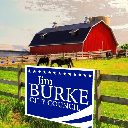 A campaign yard sign on a fence